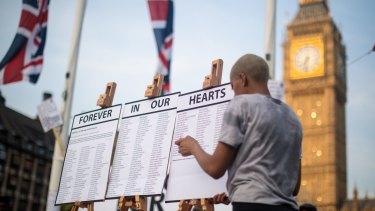 A list of the residents are placed on easels during a vigil for the victims of the Grenfell Fire.