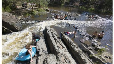 Melburnians cool off at the swimming spot on Sunday. 