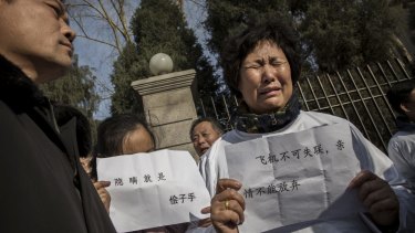 A relative of a passenger on MH370 at a protest outside the Malaysian Embassy in Beijing.