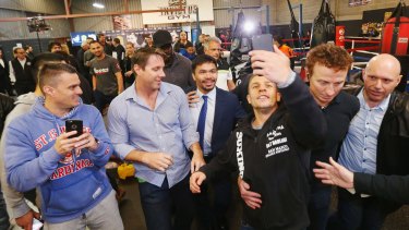 Social star: Manny Pacquiao is mobbed at Invictus Gym in Melbourne.