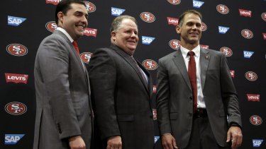 "He works hard and I would expect him to make a nice jump from year one to year two": Trent Baalke, right, with 49ers CEO Jed York, left, and new head coach Chip Kelly.