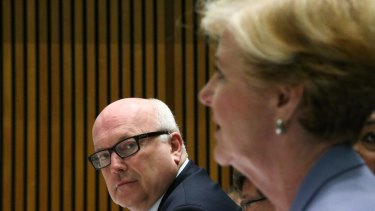 In less-happy times: Attorney-General George Brandis and Gillian Triggs.