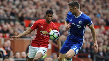 Manchester United's Marcus Rashford (left) is challenged by Chelsea's Gary Cahill.
