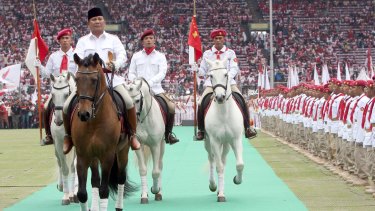 Opposition leader Prabowo Subianto, left, has been approached by Indonesian President Joko Widodo in an appeal for calm ahead of Friday's protest. 