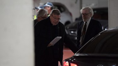 Cardinal George Pell leaves the car park of his lawyer's offices.