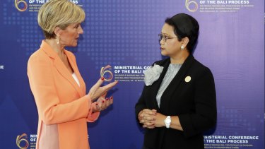 Indonesia Foreign Minister Retno Marsudi, right, listens to Julie Bishop during the Bali Process regional ministerial meeting in Bali.