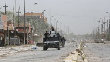 Iraqi counter-terrorism forces patrol Fallujah, Iraq on Monday, June 27.