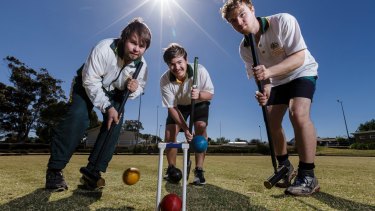 No money in it: Elite croquet players (left to right) Robert, Greg and Mal Fletcher of Dundonnell, practise at Lismore Croquet club in western Victoria.  