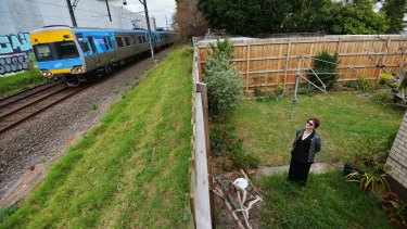 Michelle Clarke in the backyard of her Carnegie home, which backs onto the tracks where the sky rail will be built.