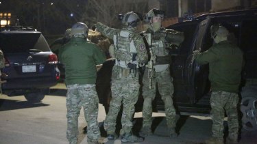 US soldiers respond to a car bomb attack by Taliban militants near a foreign guesthouse in Kabul, Afghanistan.
