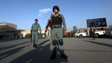 Afghan security forces secure the site of the blast.