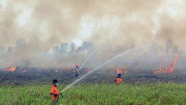 Firemen contain a fire in Ogan Ilir, South Sumatra.