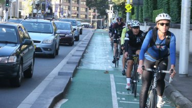 Cyclists on the College Street cycleway, which is facing removal. 
