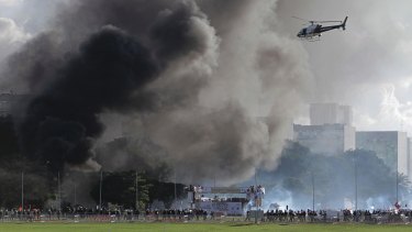 Smoke billows from fires started during violent demonstrators in Brasilia. 