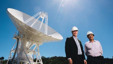 Station Director Ed Kruzins and Network Director Al Bhanji with Deep Space Station 36, the new antenna set to be officially opened on Thursday.