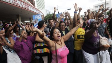 People in Havana cheer for the release of three members of the Cuban Five.