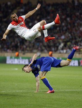 Up and above: Monaco's Layvin Kurzawa in the air above Stephan Lichtsteiner.