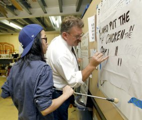 Handy skill: Mike Meyer shows his craft to workshop student Doris Lim.