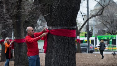 Residents protest over the removal of trees in the St Kilda Road area for the Melbourne Metro Rail project. 