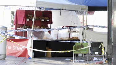A blood-soaked chair at the Brasserie Bread stand at Westfield Hornsby, where people were injured after police opened fire on a man with a knife.