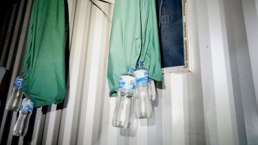 Bottles collecting rainwater to use for drinking at the former Manus Island detention centre.