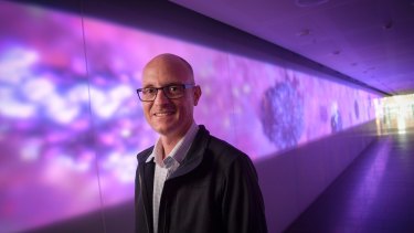 Biomedical animator Drew Berry at the Walter and Eliza Hall Institute's illuminated 27-metre artwork <i>Fiat Lux</i>.
