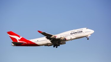 A man had to be restrained and removed from a Qantas flight from Perth to Sydney on Sunday after be became aggressive. 