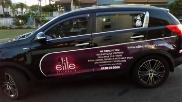 Elite Strippers are advertising on the side of a car used for Uber