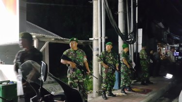 Indonesian army stand guard outside Bali's Kerobokan jail after the deadly gang fight.