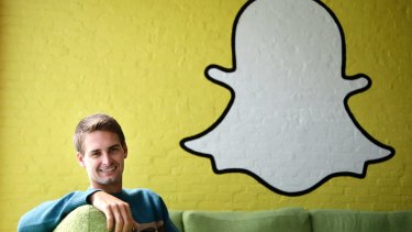Snapchat co-founder Evan Spiegel, with the company's logo. The Venice, California, start-up relies on advertising to users who watch videos compiled by its staff and those from media brands. 