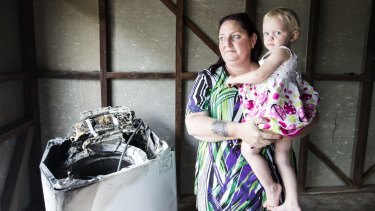 Patricia Borg, and her granddaughter Miracle, aged 2. Patricia is the owner of a Samsung
washing machine that caught fire. Thursday 14th April 2016 photo Louie Douvis SMH