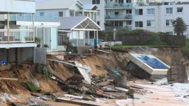 The Collaroy homes, including Mr Silk's at left, and the smashed pool, in the immediate wake of the storm.