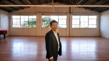 Mr Wu in the North Melbourne building he has bought for $2 million to convert into performing arts studios.