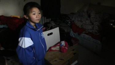 Xu Tingting, 9, in her family's one-room apartment. Picun Village, on the eastern outskirts of Beijing, is home some 20,000 "migrant workers".