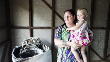 Patricia Borg, and her granddaughter Miracle, aged 2. Patricia is the owner of a Samsung
washing machine that caught fire. 