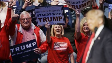 Supporters cheers as Republican presidential candidate Donald Trump speaks during a campaign stop.