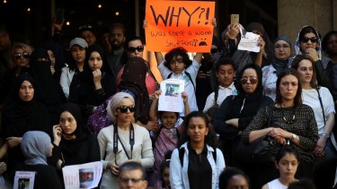 Protesters demonstrate outside Kensington Town Hall on Friday. Police have said that some victims may never be identified.