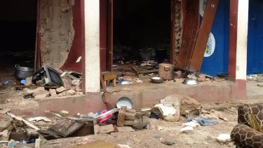 In this photo taken on a mobile phone, debris lays strewn over the area after a bomb exploded at a mosque in Jos, Nigeria on Sunday.