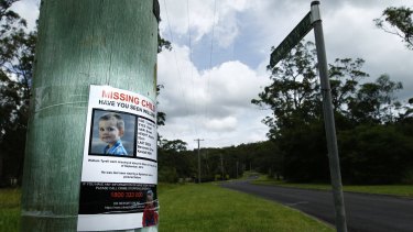 A poster on a telegraph pole at the start of Benaroon Drive, Kendall asking for information about missing toddler William Tyrrell.