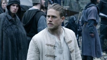 Charlie Hunnam portrays the young Arthur as an amiable chancer in King Arthur: Legend of the Sword.