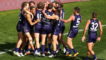 Fitting finale: Matthew Pavlich is congratulated after kicking his 700th goal in the Freemantle-Western Bulldogs clash at Domain Stadium.