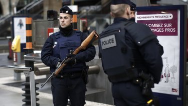 French police officers patrol the platforms at the Gare du Nord train station in Paris, France on Saturday.