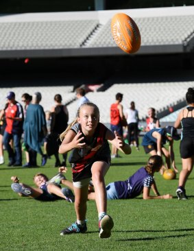 Ella Russell takes a mark at the MCG. 
