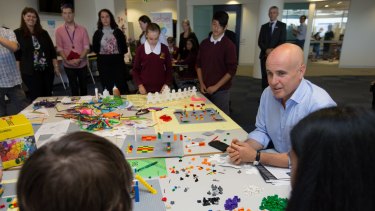 NSW Minister for Education, Adrian Piccoli, with students from Campbelltown Performing Arts School, in one of the collaborative learning spaces.