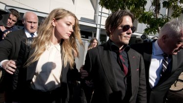 Depp leaving Southport Magistrates Court, Queensland, with Heard in April after she pleaded guilty to falsifying travel documents to sneak her dogs into Australia.