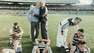 Malcolm Blight after the '89 grand final loss. with players including Couch (bottom right). 