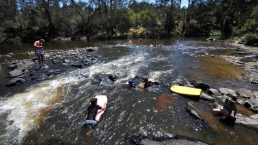 Swimmers at Pound Bend, near the Parks Victoria facility where toxic waste was washed into the river.