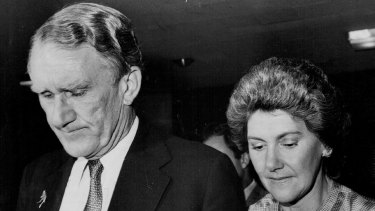 A beaten Malcolm Fraser leaves the Liberal function late on election right.