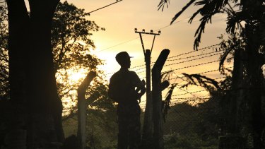 A border patrol guard at a police post in Kyee Kan Pyin, Buthidaung, in the Rakhine state of Myanmar.