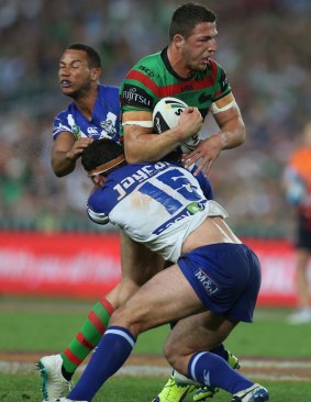 Burgess smashes through the defensive line during the 2014 NRL grand final. 